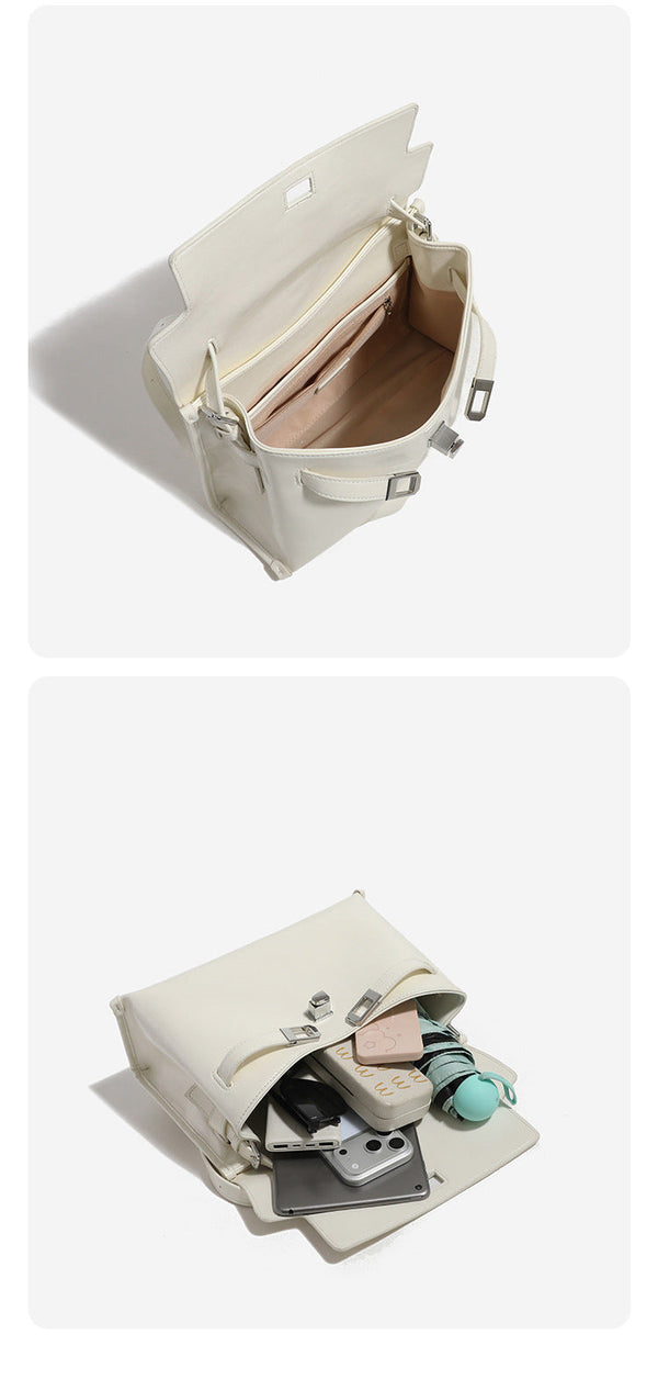Structured rectangular flap shoulder bag in glossy leather-look finish with silver-tone turn-lock closure and adjustable