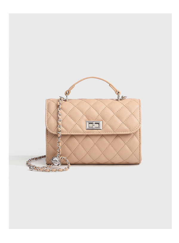 Small structured diamond-quilted flap satchel bag with silver-tone chain strap and turn-lock closure, detail view 14