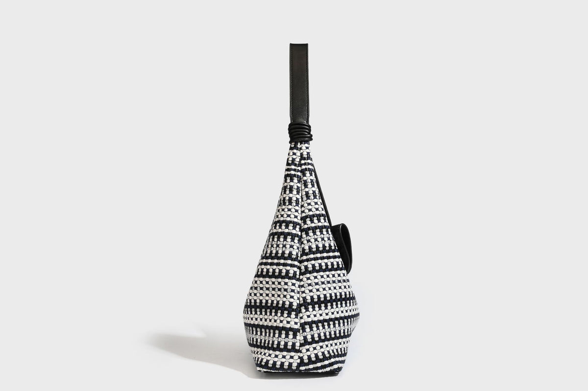 Slouchy woven stripe hobo shoulder bag with black-and-white pattern and leather-look strap, detail view 24
