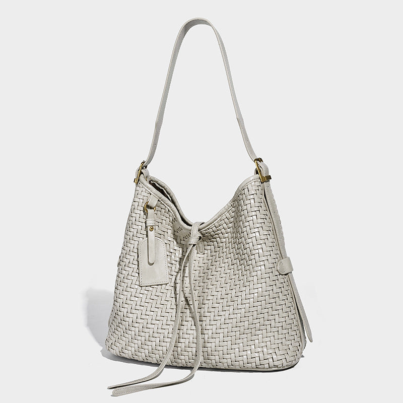 Slouchy woven-texture bucket shoulder bag with tassel tie closure and gold-tone hardware, detail view 8