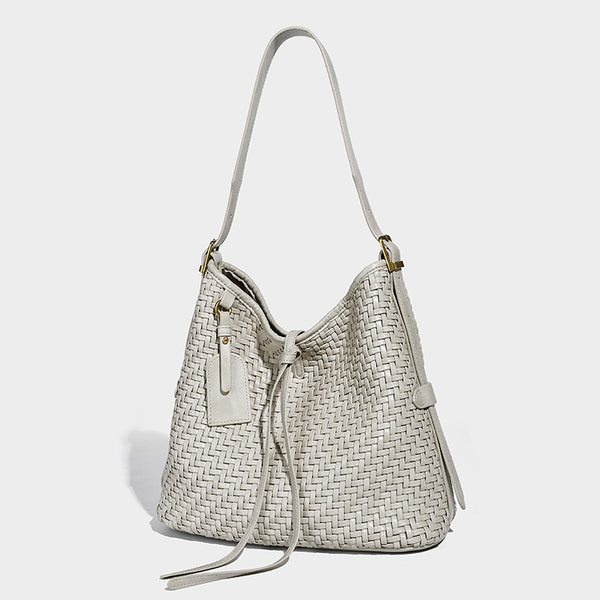 Slouchy woven-texture bucket shoulder bag with tassel tie closure and gold-tone hardware, detail view 8