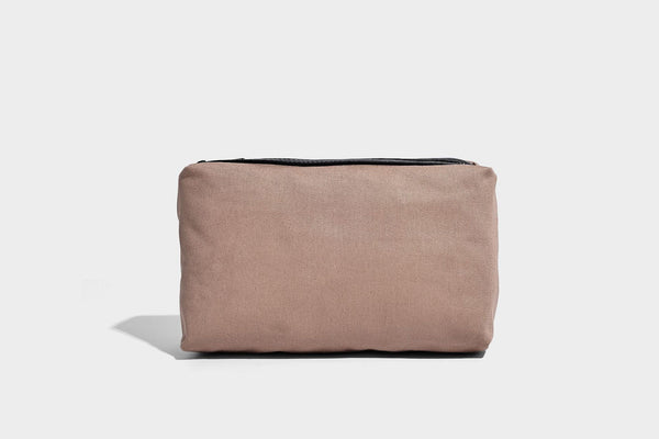 Structured rectangular tote satchel in denim-look fabric with dark trim, knotted front strap hardware, and detachable, detail