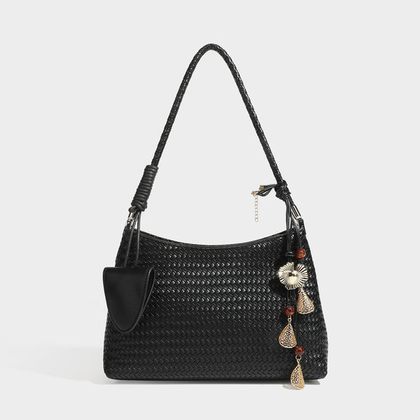 Woven-texture hobo shoulder bag in brown with braided top handle, adjustable crossbody strap, front flap pocket, and, detail