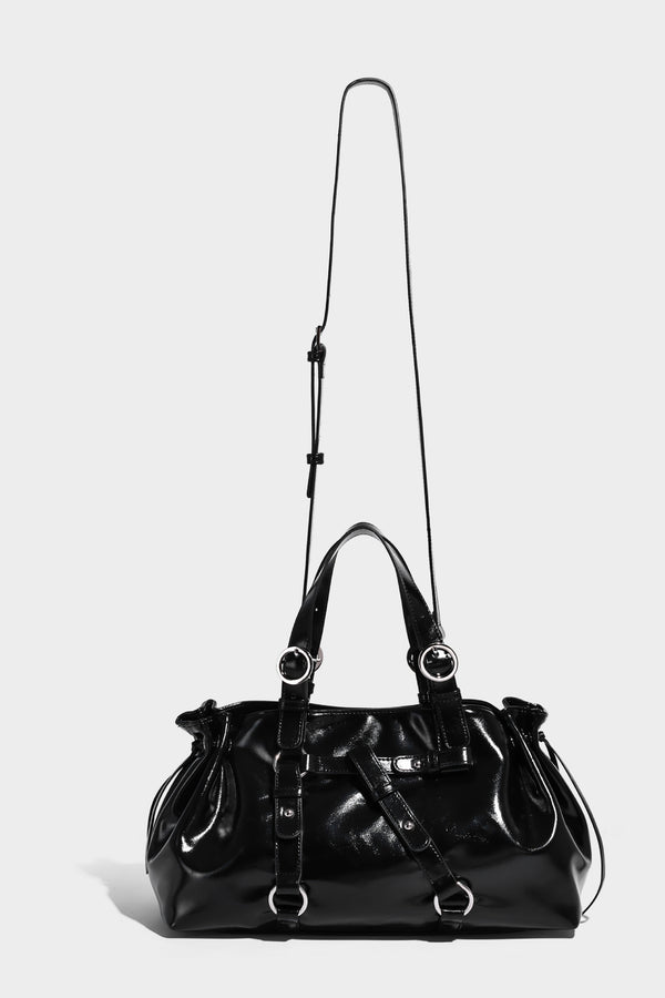 Glossy patent-look slouchy tote bag with ruched drawstring sides, dual top handles, silver ring hardware, and detachable