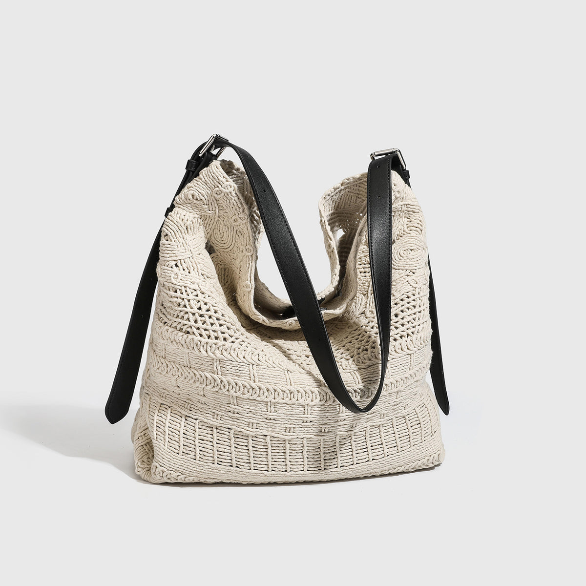 Cream woven rope-cord hobo bag with black adjustable leather-look strap and matching cream drawstring pouch, detail view 4