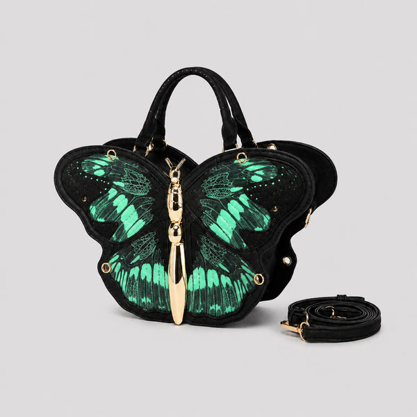 Schwarze Handtasche in Schmetterlingsform mit rosafarbenem Print auf den Flügelpartien und goldfarbenem, skulpturalem Reißverschlussanhänger in Form eines Schmetterlingskörpers, Detailansicht 6
