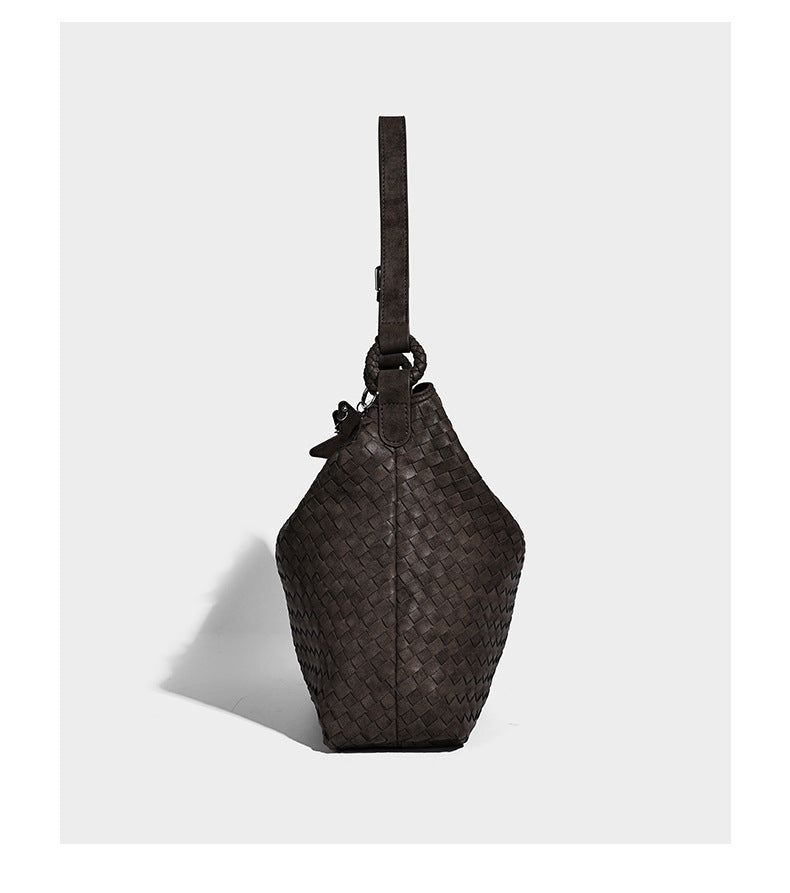 Large soft woven hobo shoulder bag with matte textured finish, adjustable strap, and star charm hardware, detail view 10