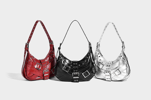 Glossy crescent hobo bag with silver-tone grommets, square buckle straps, and top zipper closure, detail view 9