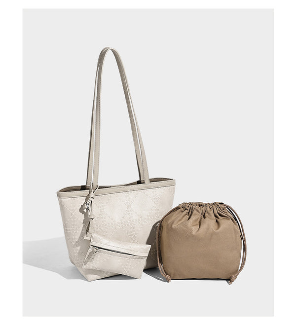 Quilted diamond-pattern tote bag with attached front zip pouch and long shoulder straps, detail view 8