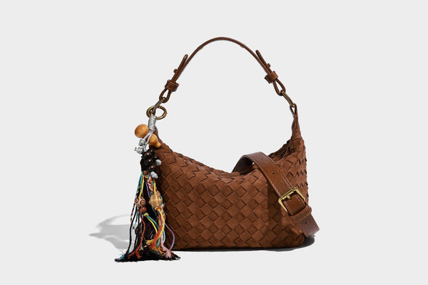 Small woven-texture crescent hobo bag in dark chocolate brown with top zip closure, gold-tone hardware, and adjustable