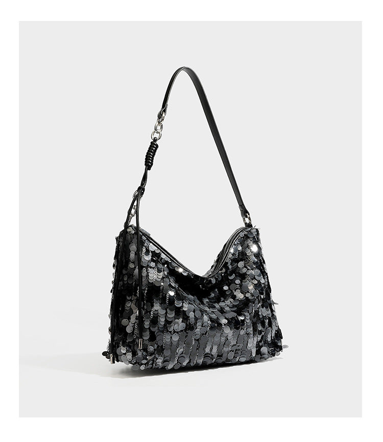 Slouchy paillette sequin hobo shoulder bag with zip closure and adjustable leather-look strap with silver chain hardware