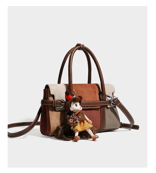 Structured color-block satchel bag in brown, rust, beige, and taupe suede-look panels with white topstitching, front buckle