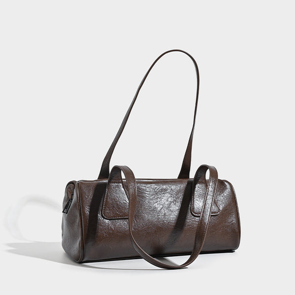 Glossy leather-look barrel shoulder bag with zip closure and top handles, detail view 3