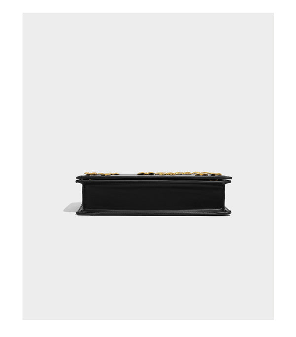 Slim rectangular crossbody bag with gold-tone butterfly metal appliqués and fine antiqued chain strap, detail view 10