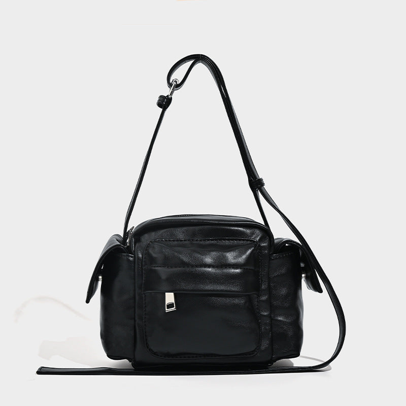 Boxy leather-look crossbody bag with front zip pockets, top zip closure, and long adjustable strap, detail view 6