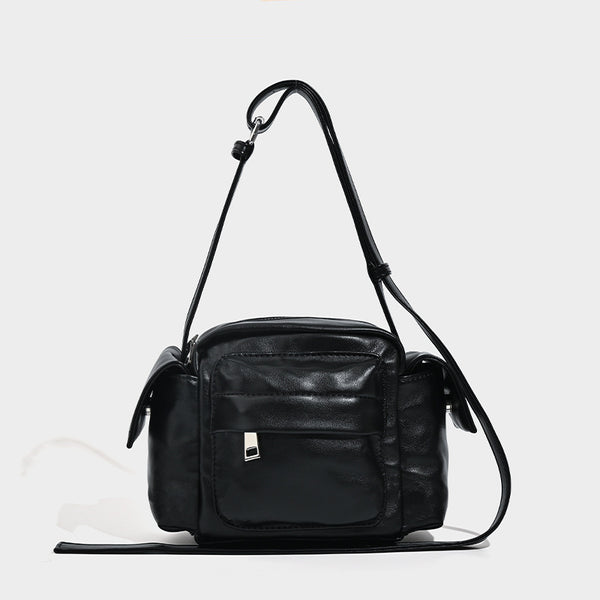 Boxy leather-look crossbody bag with front zip pockets, top zip closure, and long adjustable strap, detail view 6