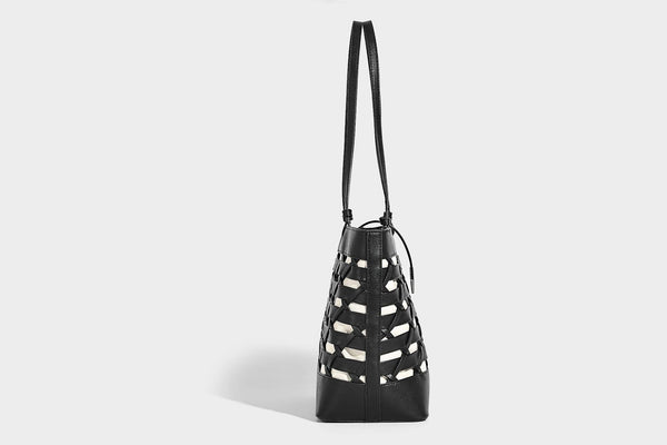 Structured woven lattice cutout tote bag with smooth leather-look trim, dual shoulder straps, and silver-tone hardware