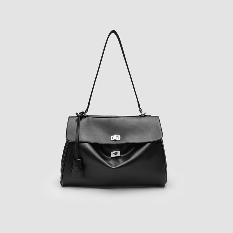 Structured black leather-look flap satchel bag with silver turn-lock hardware and top handle, detail view 8