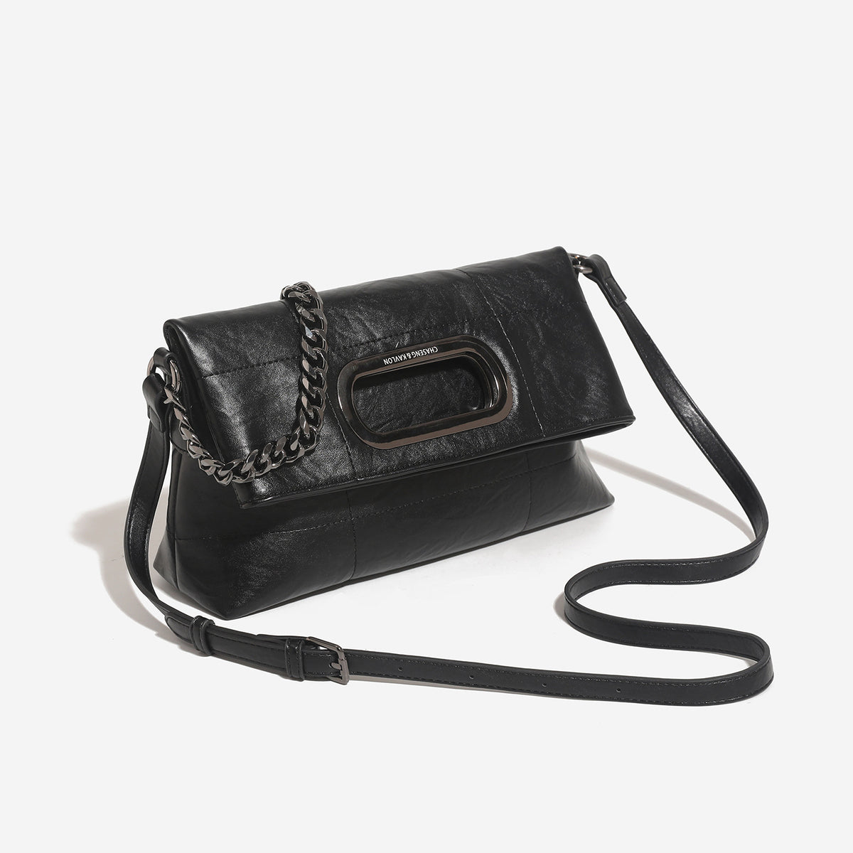Soft rectangular leather-look convertible shoulder bag with dark curb-chain strap and rounded rectangular metal handle