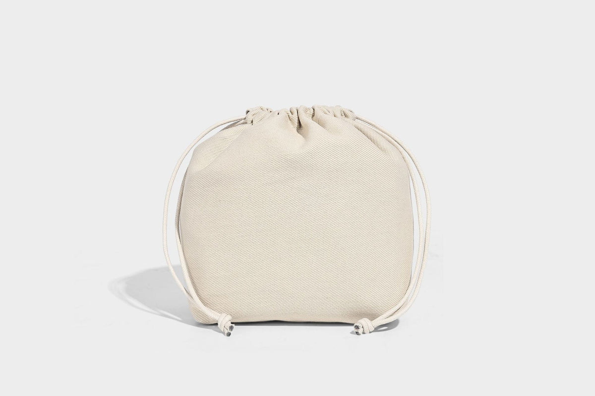 Structured pebbled leather-look tote bag in taupe with long shoulder strap, detachable zip pouch, and pink tulip flower