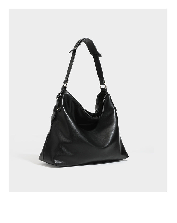 Large slouchy hobo shoulder bag in dark brown with smooth leather-look finish, adjustable strap, and silver-tone hardware
