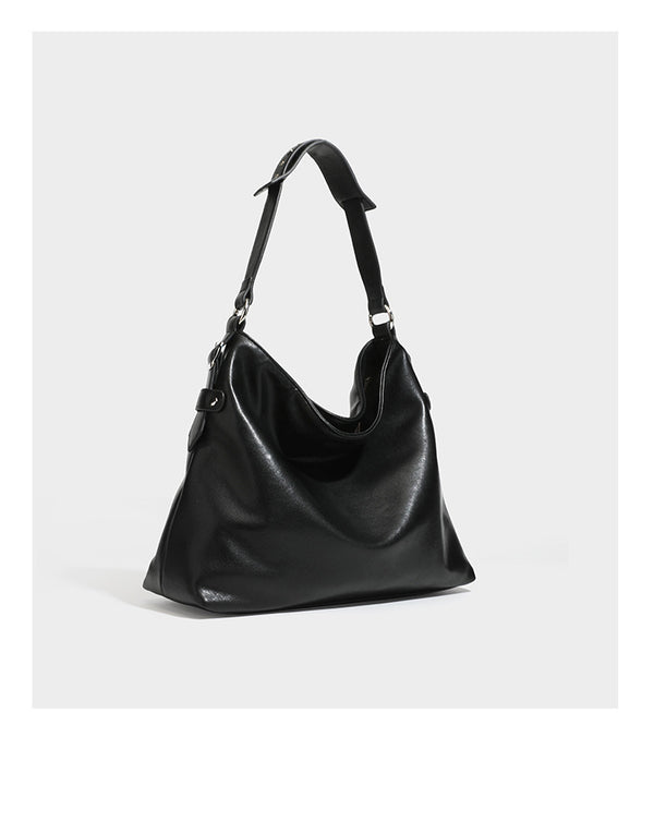 Large slouchy hobo shoulder bag in dark brown with smooth leather-look finish, adjustable strap, and silver-tone hardware