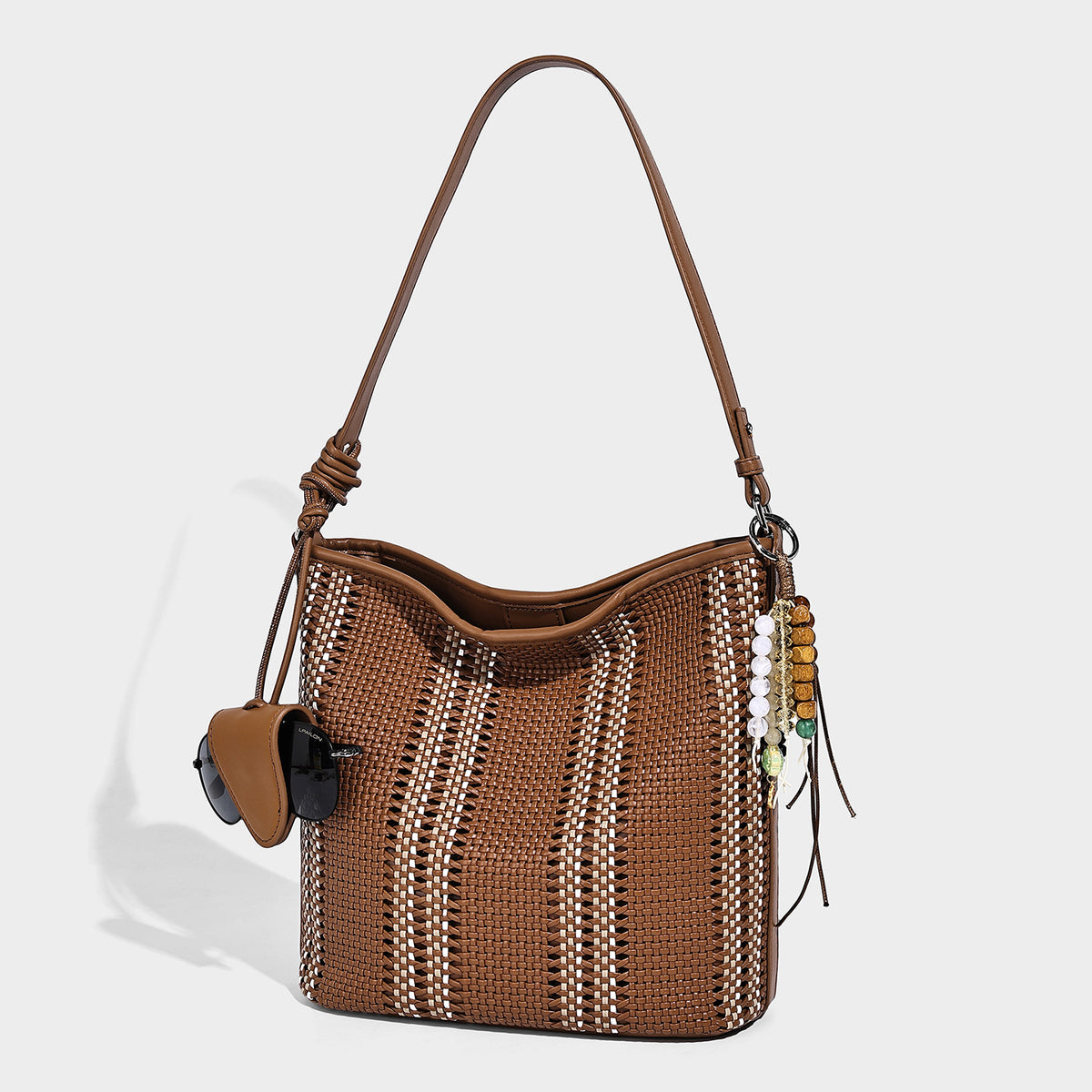 Woven bucket shoulder bag with leather-look trim, silver-tone hardware, and beaded tassel charm, detail view 15