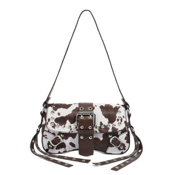 Mini square cow-print leather-look shoulder bag with metal stud hardware and dual carry straps, detail view 5