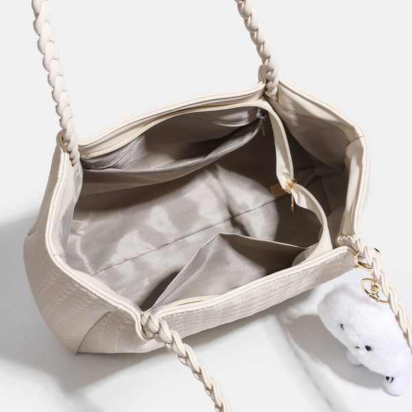Structured geometric-embossed tote bag with braided shoulder straps and gold-tone hardware in ivory, detail view 4