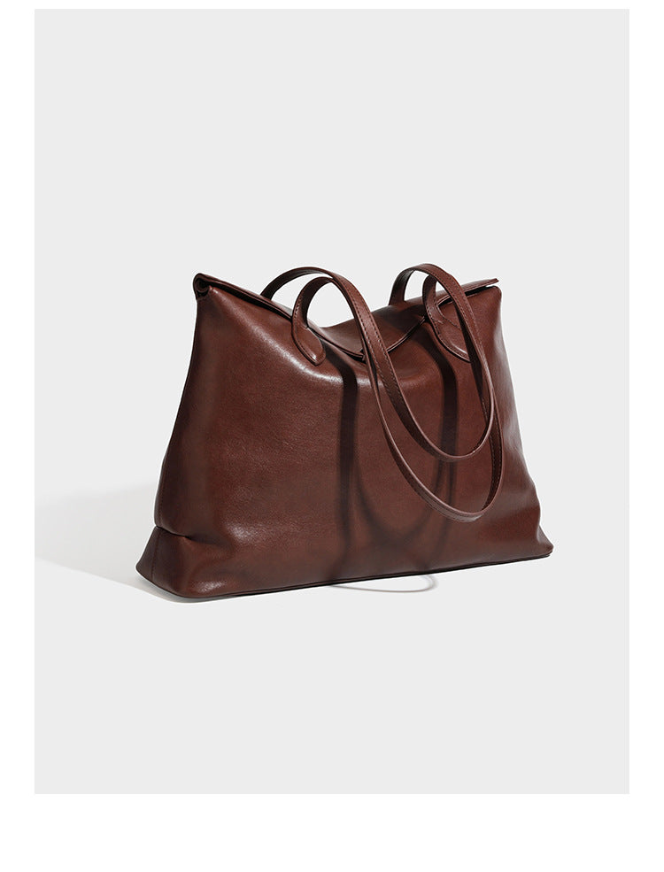 Large leather-look tote shoulder bag with slim double straps and silver-tone turn-lock closure, detail view 7