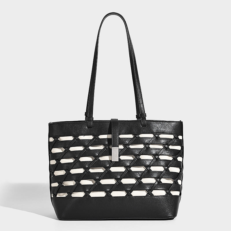Structured woven lattice cutout tote bag with smooth leather-look trim, dual shoulder straps, and silver-tone hardware