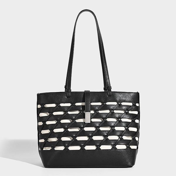 Structured woven lattice cutout tote bag with smooth leather-look trim, dual shoulder straps, and silver-tone hardware
