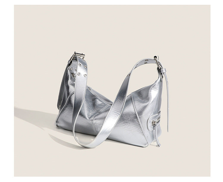 Glossy crinkled mini hobo shoulder bag with studded adjustable strap and silver-tone hardware, detail view 12