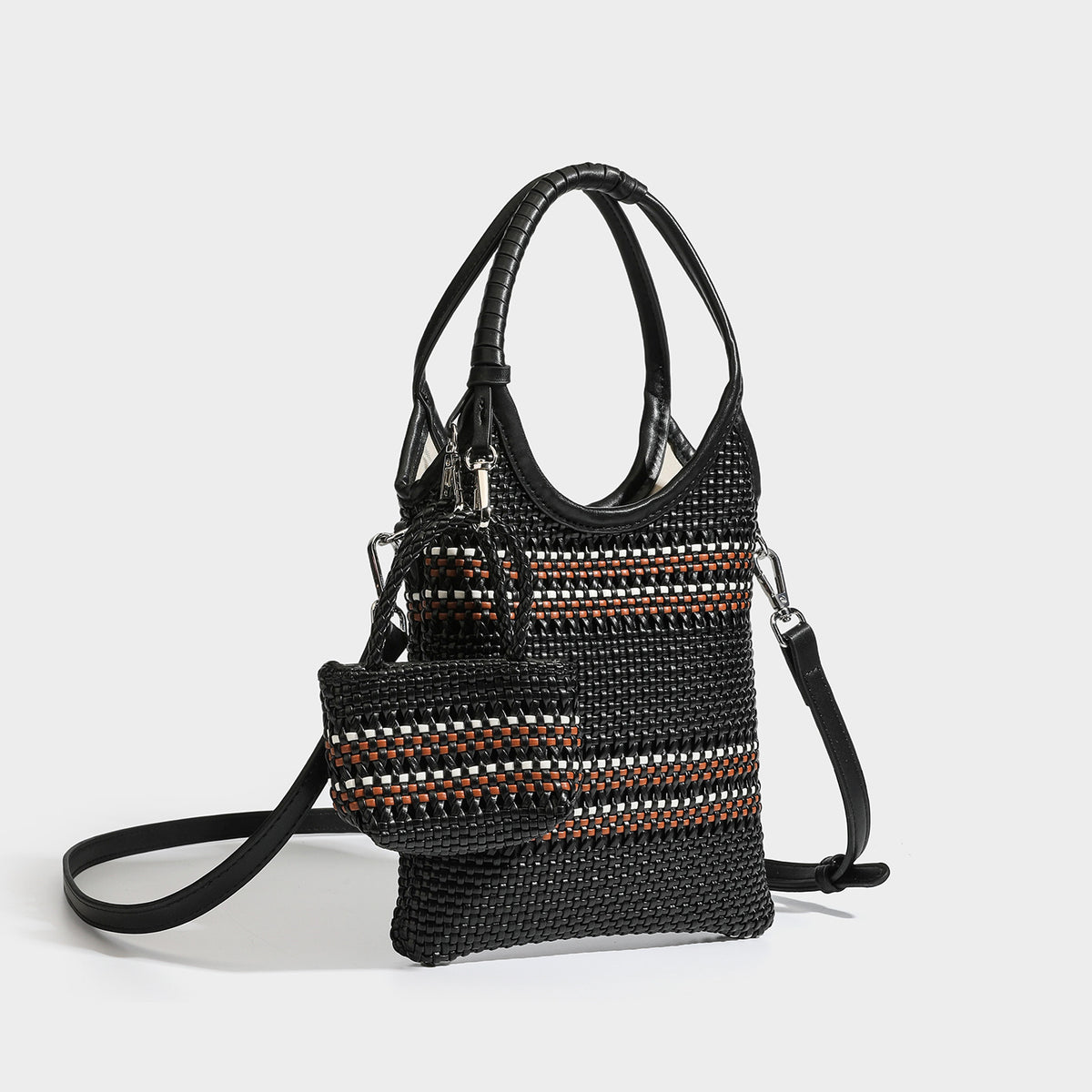 Color-block woven tote bag with rounded leather-look handles, detachable crossbody strap, and matching mini clip-on pouch in
