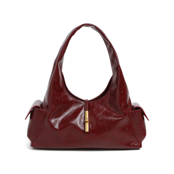 Slouchy leather-look hobo shoulder bag with gold-tone bar clasp and crinkled glossy finish, detail view 5