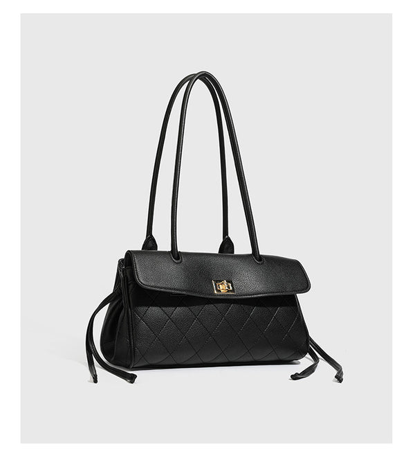Structured black diamond-quilted shoulder bag with gold-tone turn-lock flap closure and dual round shoulder straps, detail