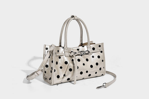 Structured glossy leather-look polka-dot satchel tote with dual top handles and detachable shoulder strap, detail view 10