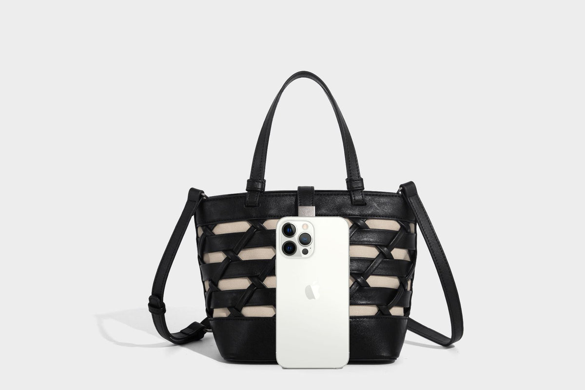 Structured woven lattice tote bag with cream lining, dual top handles, detachable crossbody strap, and silver-tone hardware