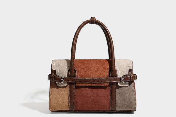 Structured color-block satchel bag in brown, rust, beige, and taupe suede-look panels with white topstitching, front buckle