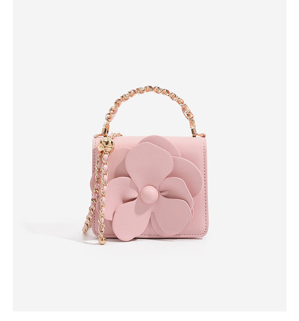 Small structured rectangular crossbody bag with layered 3D flower appliqué and gold-tone chain strap, detail view 14