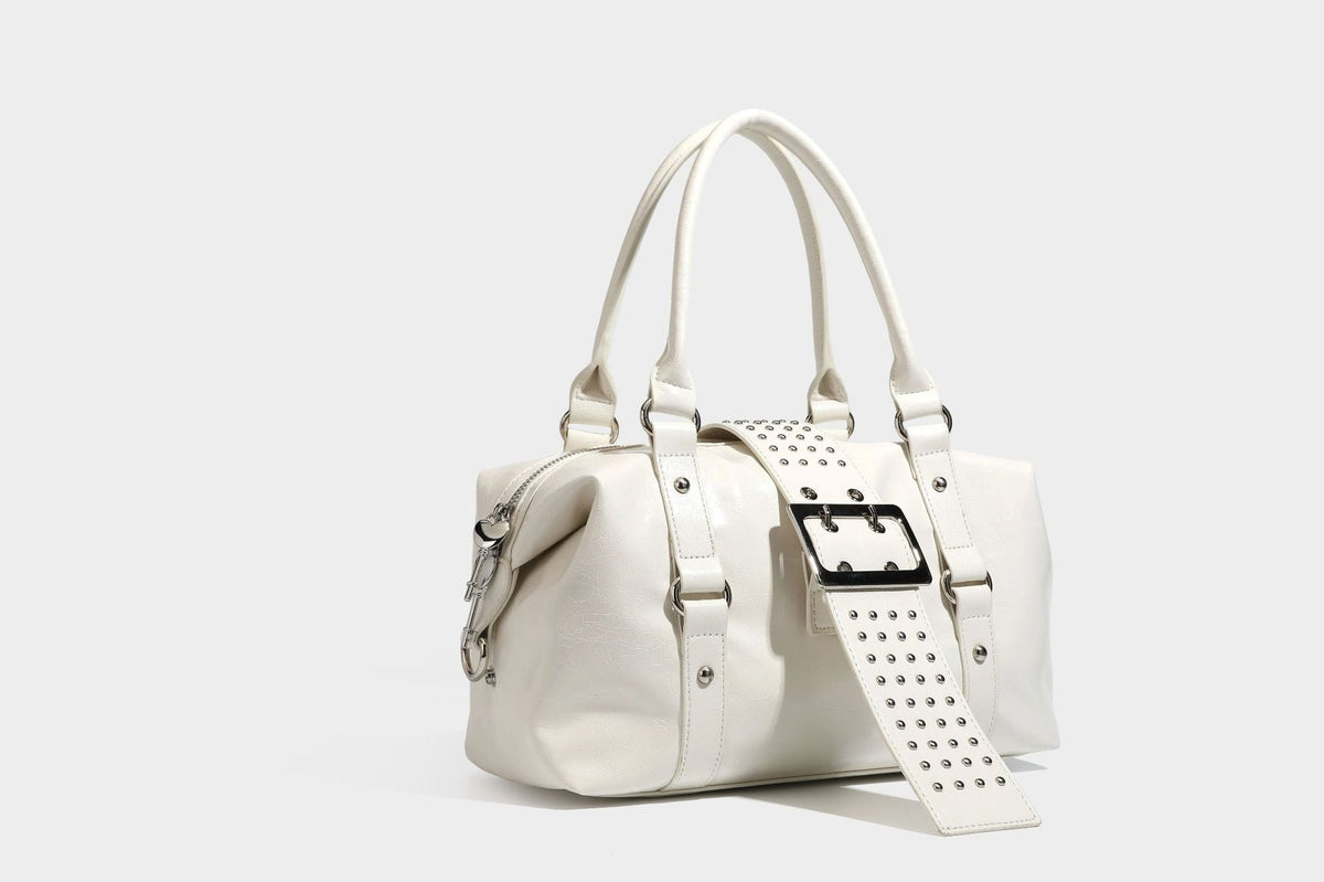 Glossy crinkled barrel handbag with silver stud buckle strap and detachable shoulder strap, detail view 21