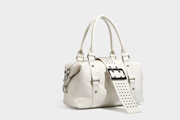 Glossy crinkled barrel handbag with silver stud buckle strap and detachable shoulder strap, detail view 21