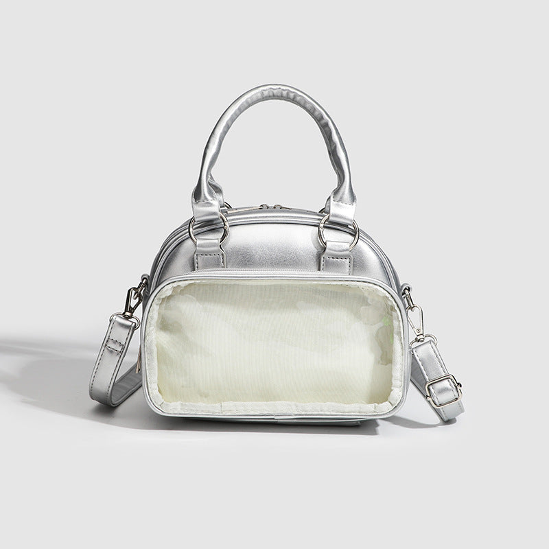 Structured mini bowling barrel bag with clear front pocket, dual top handles, and detachable crossbody strap in glossy