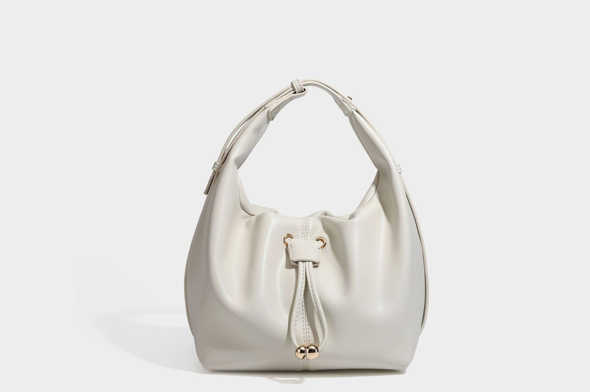 Slouchy hobo bag with smooth leather-look finish, drawstring cinch closure, and gold-tone bead hardware, detail view 21