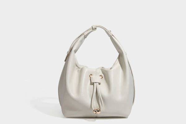Slouchy hobo bag with smooth leather-look finish, drawstring cinch closure, and gold-tone bead hardware, detail view 21
