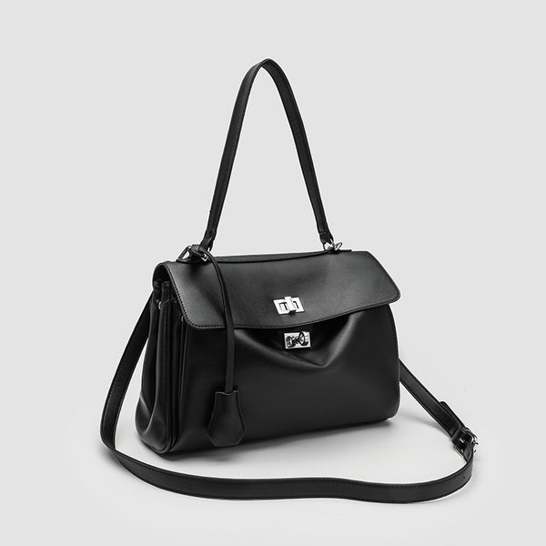 Structured black leather-look flap satchel bag with silver turn-lock hardware and top handle, detail view 3