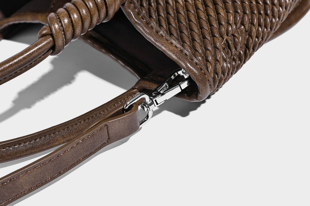 Large structured woven rope-texture tote bag with smooth leather-look trim, knotted dual top handles, detachable mini front