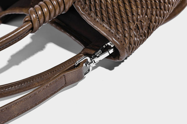 Large structured woven rope-texture tote bag with smooth leather-look trim, knotted dual top handles, detachable mini front