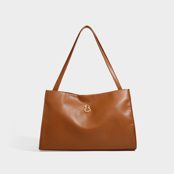 Structured rectangular shoulder tote bag with smooth leather-look finish, long double straps, and gold-tone gourd emblem on