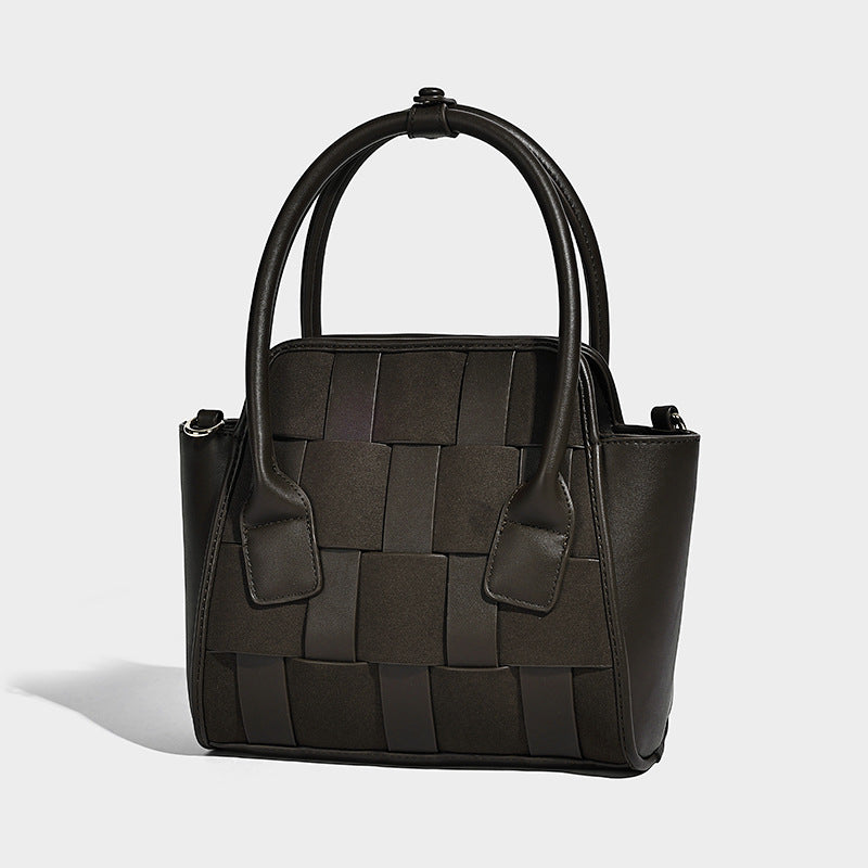 Small structured woven-panel mini tote bag with double top handles and detachable crossbody strap in matte leather-look